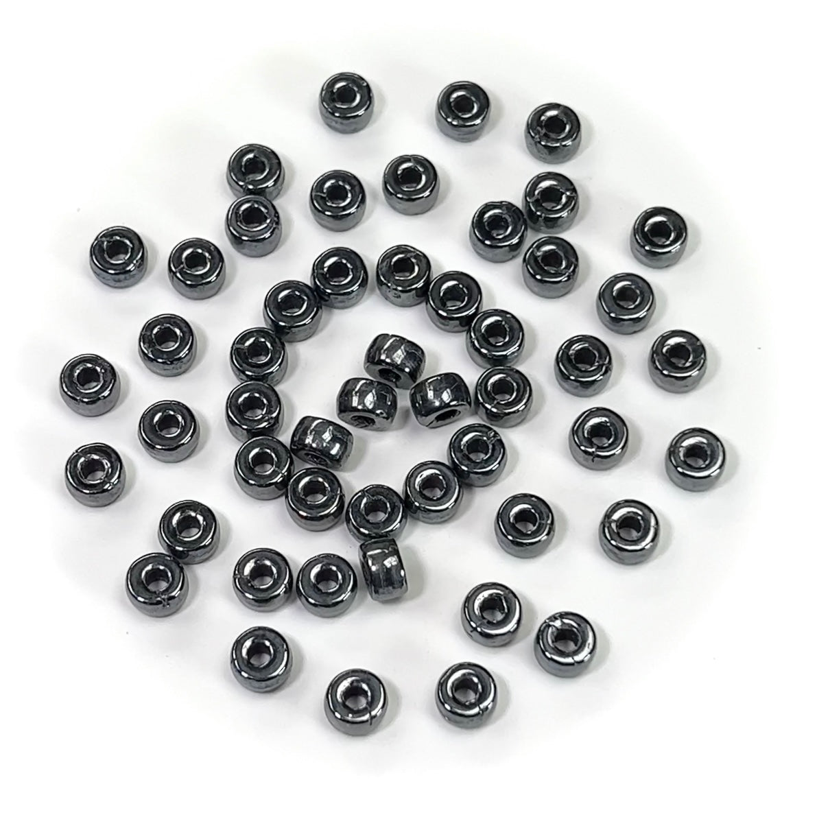 Czech Glass Druk Large Hole Roller Beads in size 6mm Jet Hematite coated 50pcs J083