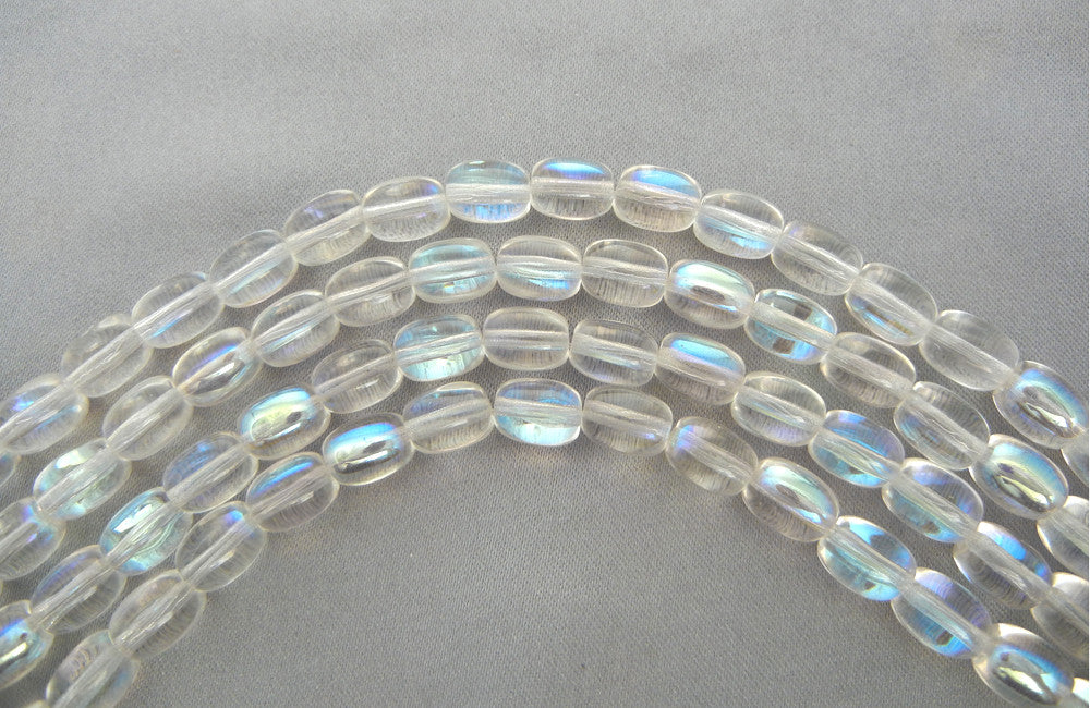 23 Czech Glass Druk Beads 9x7mm Crystal AB smooth oval, pressed, clear AB coated, P202