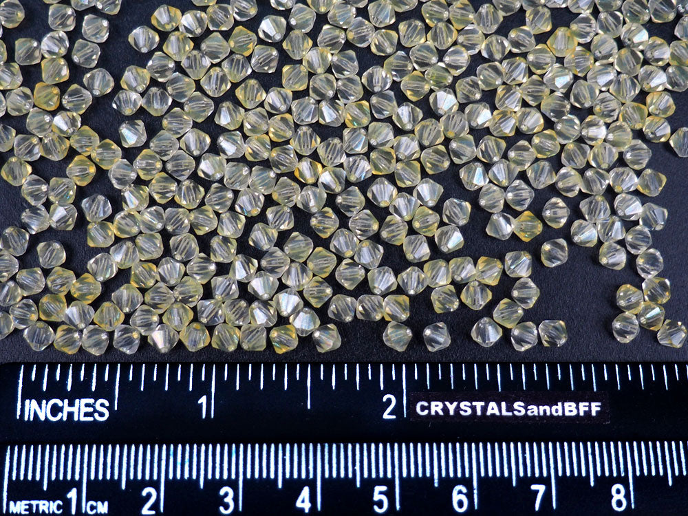 Crystal Yellow Lumi coated Czech Glass Beads Machine Cut Bicones MC Rondell Diamond Shape clear crystals coated with yellow luster 4mm 36pcs