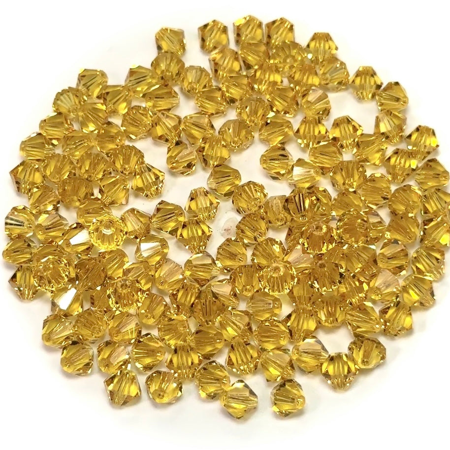 Light Topaz, Czech Glass Beads, Machine Cut Bicones (MC Rondell, Diamond Shape), medium golden brown crystals
