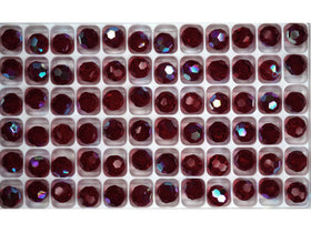 A collection of round, red-colored Czech machine cut crystal beads with an Aurora Borealis coating.