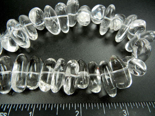 about 60 genuine rock crystal beads approx 17x13mm natural quartz