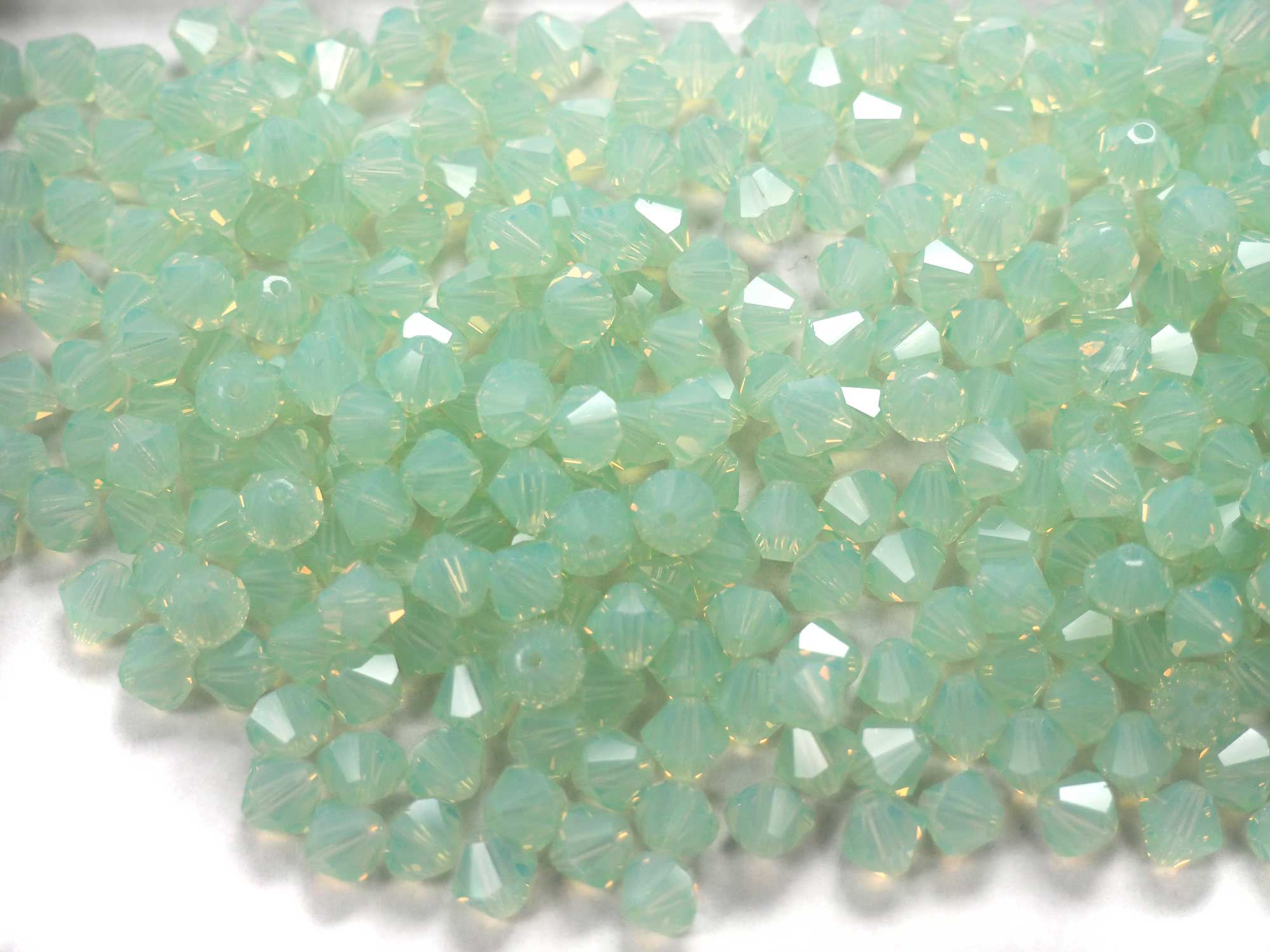Chrysolite Opal (Preciosa color), Czech Glass Beads, Machine Cut Bicones (MC Rondell, Diamond Shape), pale milky green crystals