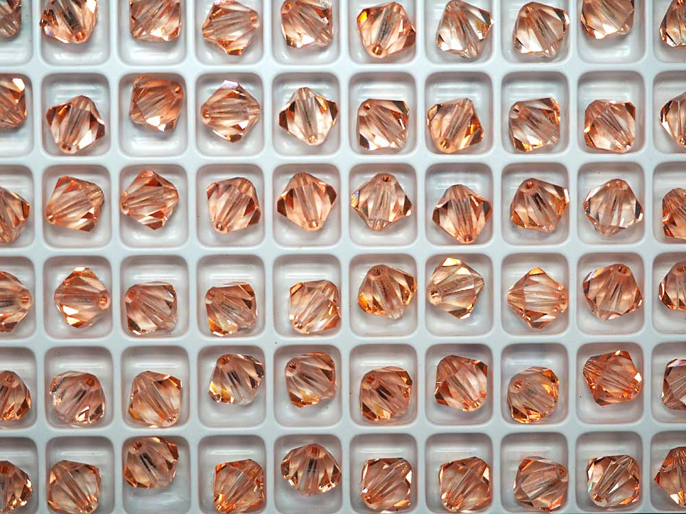 Crystal Light Orange colored, Czech Glass Beads, Machine Cut Bicones (MC Rondell, Diamond Shape), clear crystal coated with light orange, 8mm