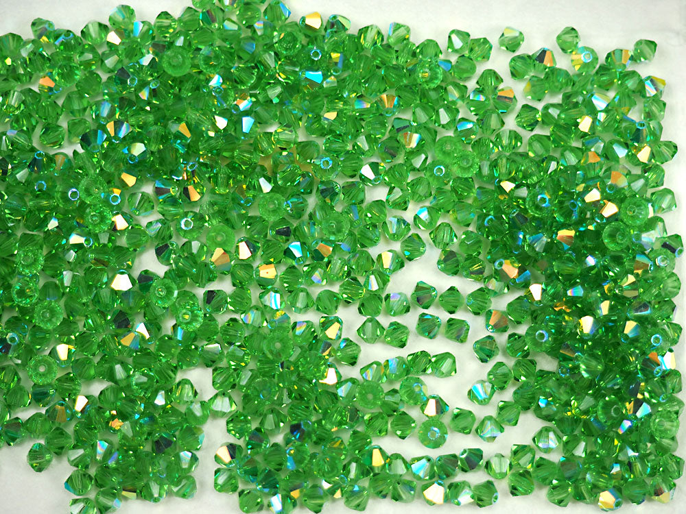 Peridot AB, Czech Glass Beads, Machine Cut Bicones (MC Rondell, Diamond Shape), light green crystals coated with Aurora Borealis