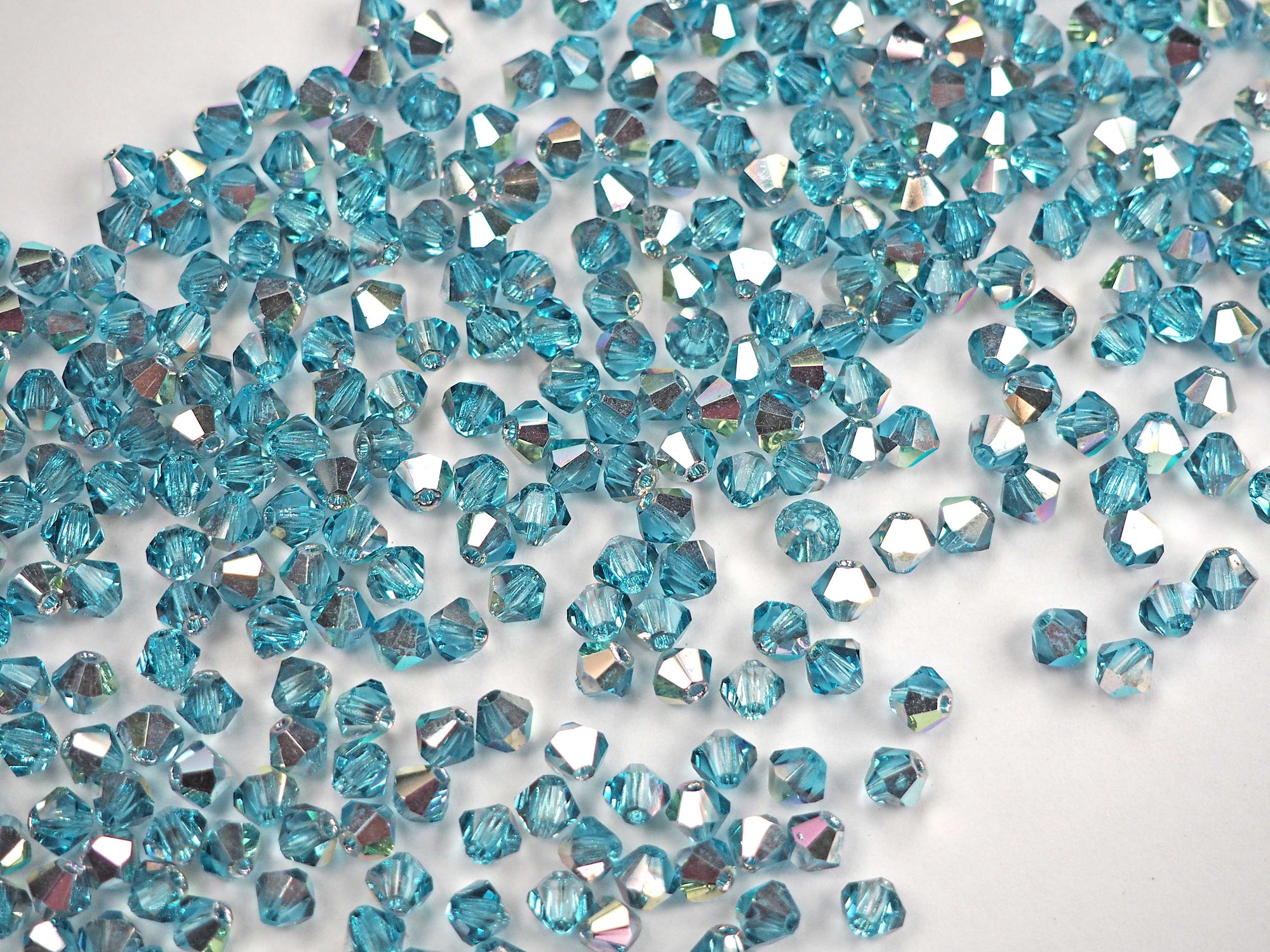 Aqua VL Vitrail Light coated, Czech Glass Beads, Machine Cut Bicones (MC Rondell, Diamond Shape), light blue aquamarine bohemica crystals coated with silvery vitrail light