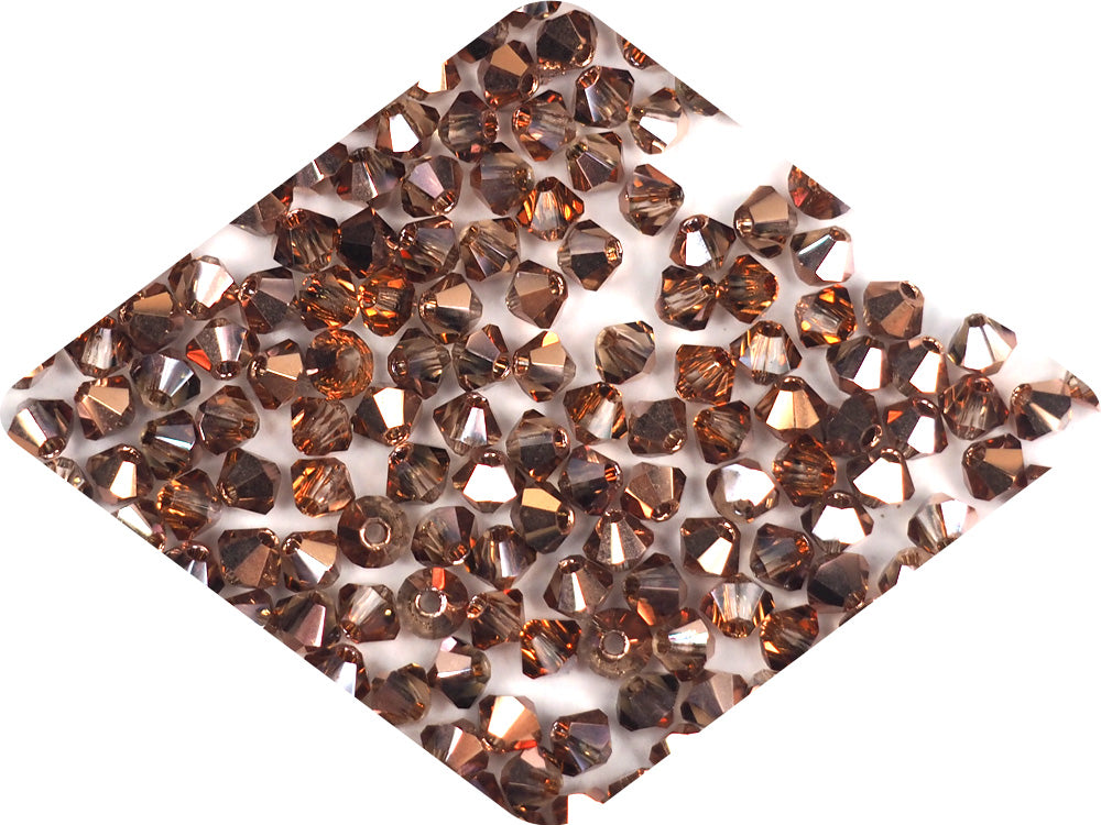 Light Peach Capri Gold coated, Czech Glass Beads, Machine Cut Bicones (MC Rondell, Diamond Shape), pink crystals coated with gold bronze